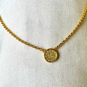 Kate Spade gold tone necklace with round pendent with clear stones